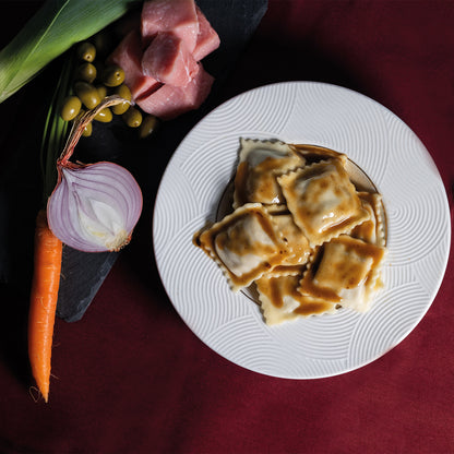 Raviolis de veau, olives vertes, jus de veau